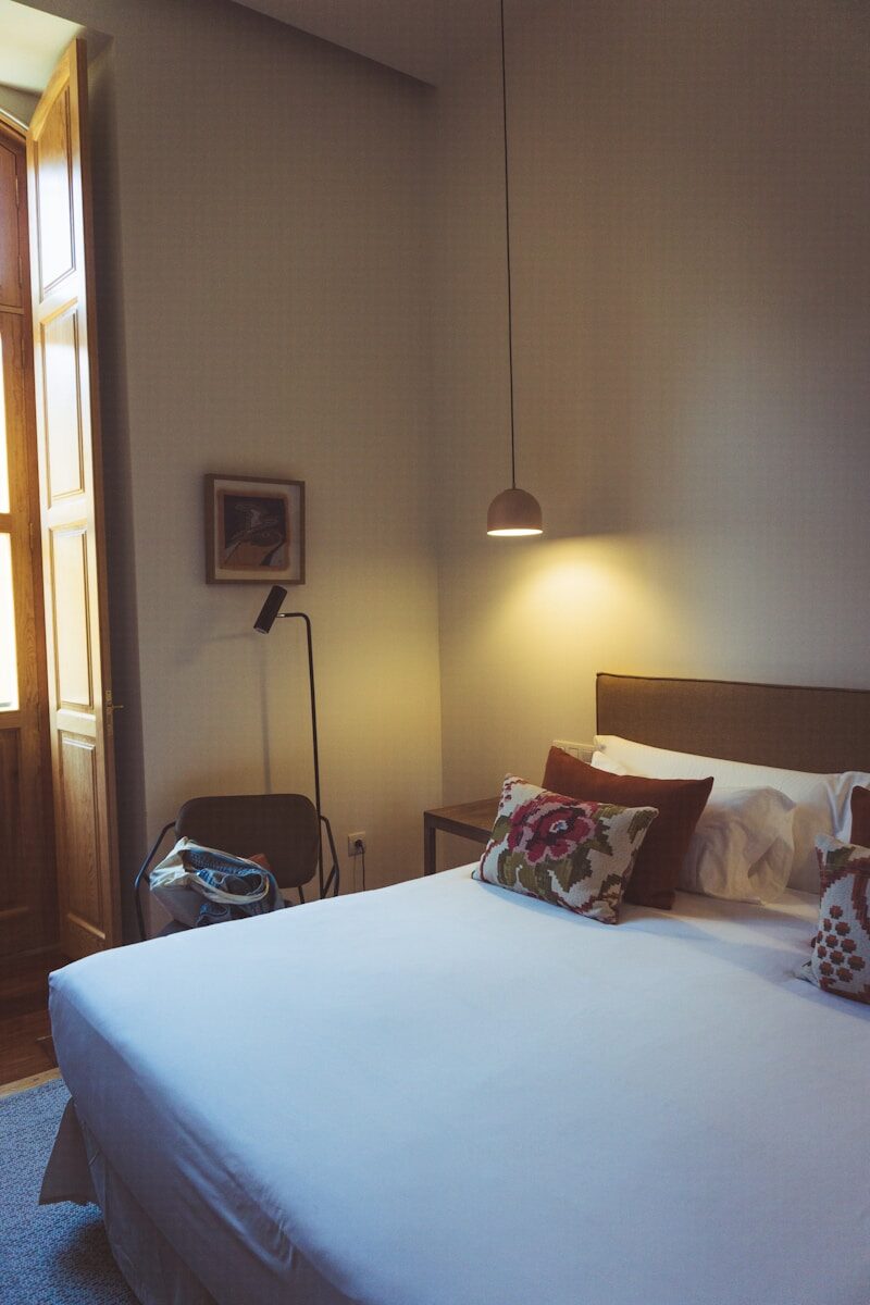a bed with a blue comforter